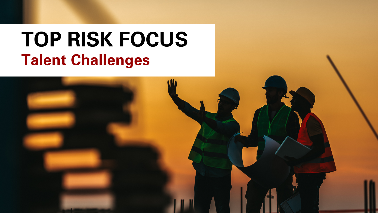 workers pointing to a building project