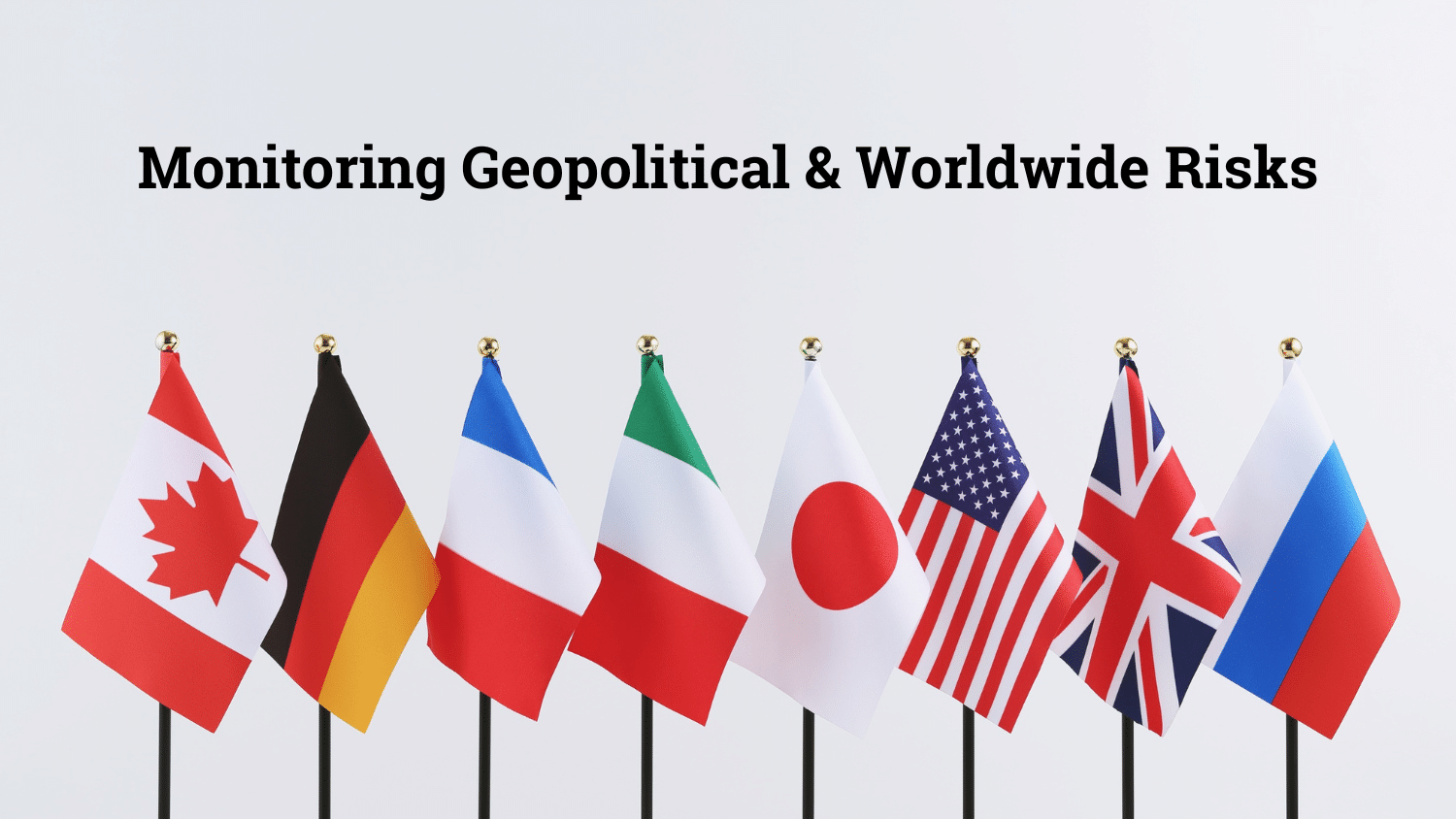 photo of flags representing a diversity of countries around the world, with text overlay, "Monitoring Geopolitical and Worldwide Risks."